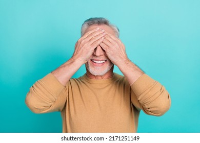 Portrait Of Satisfied Person Toothy Smile Arms Palms Cover Eyes Isolated On Teal Color Background