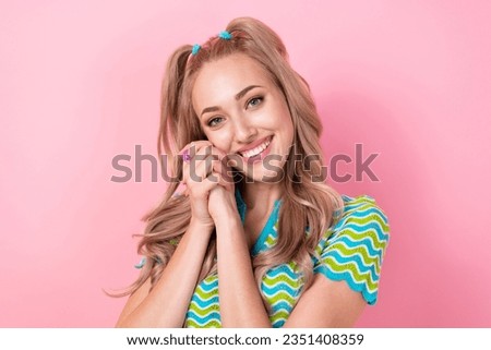 Portrait of satisfied positive nice girl with tails dressed colorful suit arms on cheekbone smiling isolated on pink color background