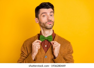 Portrait of satisfied young man hands fingers touching fix bow look camera isolated on yellow color background - Powered by Shutterstock