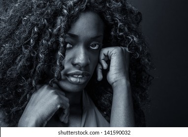 Portrait of a scared or depressed black girl.