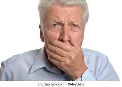 Portrait Of A Scared Senior Man On A White