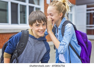 A Portrait Of School 10 Years Boy And Girl Having Fun Outside