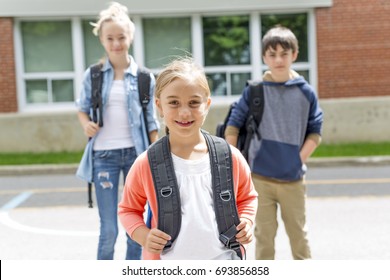 A Portrait Of School 10 Years Boy And Girl Having Fun Outside