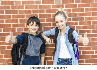 A Portrait Of School 10 Years Boy And Girl Having Fun Outside