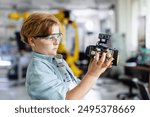 Portrait of schoolboy building robotic car in after-school robotics club. Children learning robotics in Elementary school. Science for kids.