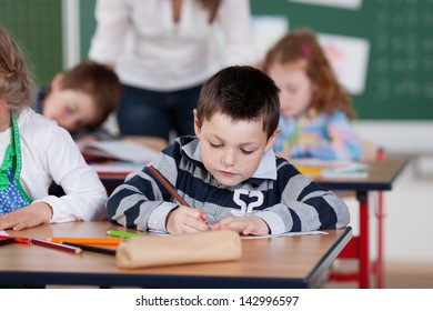 Portrait Of Schoolchildren Being Busy In Art Class At The Classroom