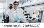 Portrait, science and happy woman on laptop in lab to research chemistry, test or innovation. Microscope, scientist and face of medical doctor in goggles for microbiology, healthcare or pharma study