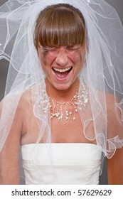 portrait of screaming bride over grey background