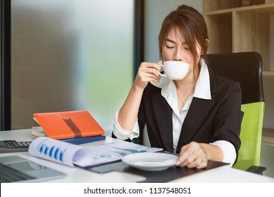 Portrait of Secretary drinking hot coffee befor work. Secretary concept.