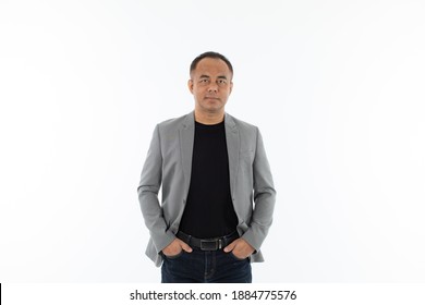 Portrait Of Self-confident Middle Age Senior Asian Man In A Black T-shirt And Grey Jacket.
Isolate On White Background.