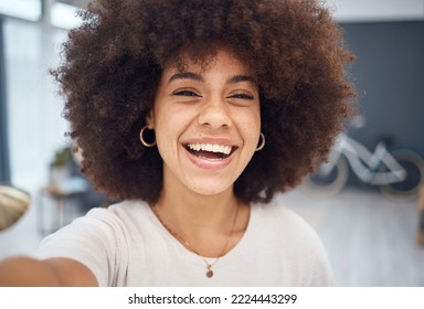 Portrait Selfie, Black Woman And Video Call In Home For Social Media, Online Network Or Influencer Vlog. Happy, Smile Or Laughing Young African Girl With Afro, Curly Hair And Happiness Relax In House