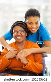 Portrait Of Senior African Disabled Woman And Her Caregiver