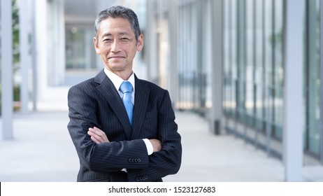 Portrait Of Senior Asian Businessman Standing 