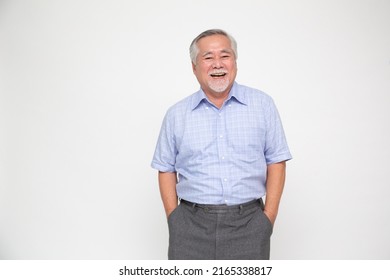 Portrait of senior asian man smile and looking at camera isolated over white background, Feeling happy concept - Shutterstock ID 2165338817