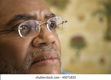 Portrait Of Senior Black Man In Eyeglasses With Serious Expression.  Horizontal Shot.