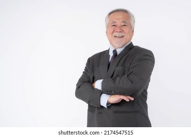 portrait of a senior business man with suit , Asian senior man , old man , feel happy good health standing arms crossed isolated on white background - lifestyle senior male concept