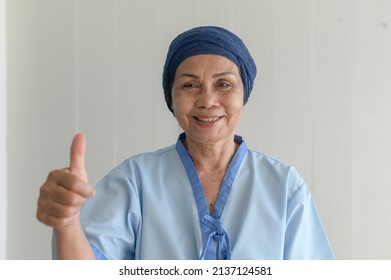 Portrait Of Senior Cancer Patient Woman Wearing Head Scarf In Hospital, Healthcare And Medical Concept