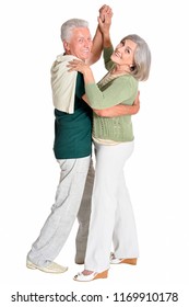 Portrait Of A Senior Couple Dancing On White Background