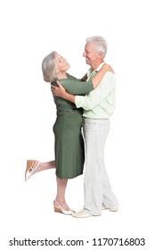 Portrait Of A Senior Couple Dancing On White Background