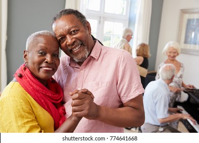 Portrait Of Senior Couple Enjoying Dancing Club Together