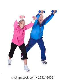 Portrait Of A Senior Couple Exercising On White Background