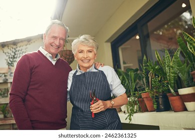 Portrait, senior couple and gardening in home with love for sustainability, environment or outdoor. Retirement, plants and elderly people with tools for eco friendly, hugging or weekend together - Powered by Shutterstock