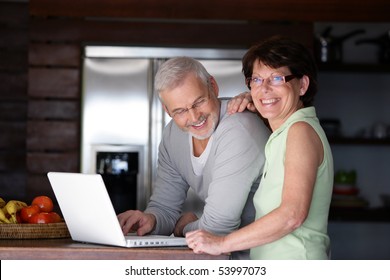Portrait of a senior couple with a laptop computer