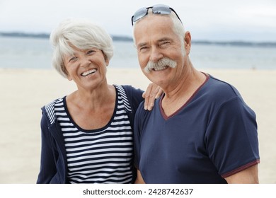 portrait of senior couple on the beach - Powered by Shutterstock