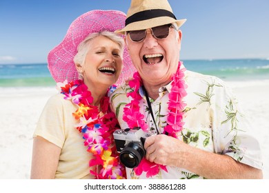 Portrait Of Senior Couple On The Beach