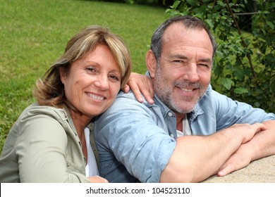 Portrait of senior couple relaxing in garden