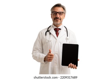 Portrait Of Senior Doctor In Doctor Coat Wearing Stethoscope And Eye Glasses, Showing Thumbs Up And Digital Tablet Blank Screen. Isolated On White Background.