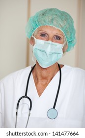 Portrait Of Senior Female Surgeon Wearing Mask In Hospital