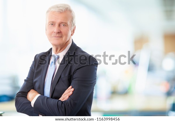 Portrait Senior Financial Advisor Standing Arms Stock Photo Edit Now 1163998456