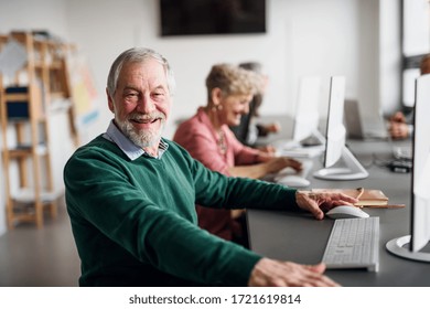 Portrait Of Senior Man Attending Computer And Technology Education Class.