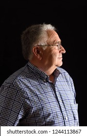 Portrait Of A Senior Man With Black Background