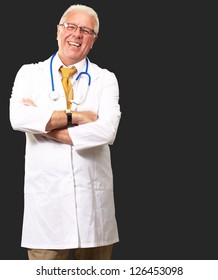 Portrait Of A Senior Man Doctor Isolated On Black Background