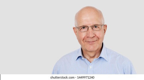 Portrait Of Senior Man With Glasses. Studio Shot With Copy Space