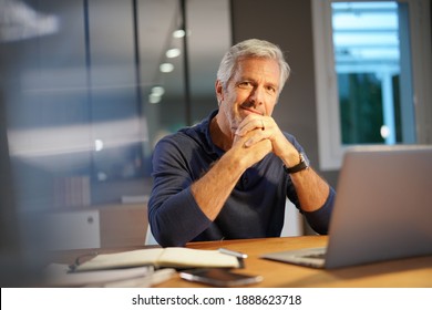 Portrait Of Senior Man With Grey Hair Connected With Laptop