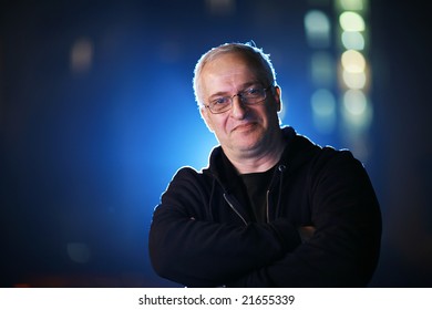 Portrait Of A Senior Man At Night. Shallow DOF.