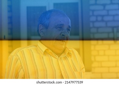 Portrait Of A Senior Man Outdoors. 70s Years Old Latin Or Hispanic Man Standing Outside In Summer Day. Casual And Lifestyle Concept. Ukrainian Flag.