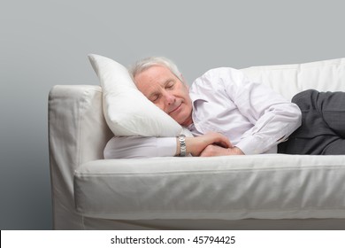 Portrait of a senior man resting in a couch