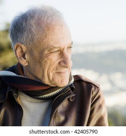 Portrait Of A Senior Man In Scarf And Leather Jacket