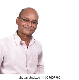 Portrait Of A Senior Man Smiling Against White Background. A Senior Indian / Asian Man - Isolated On White
