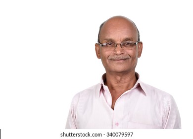 Portrait of a senior man smiling against white background. A senior Indian / Asian man - isolated on white
