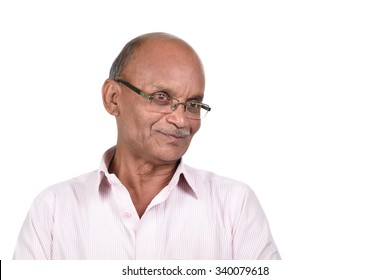 Portrait Of A Senior Man Smiling Against White Background. A Senior Indian / Asian Man - Isolated On White
