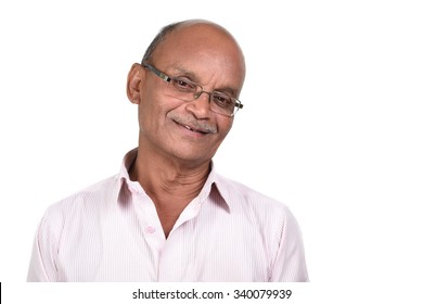 Portrait Of A Senior Man Smiling Against White Background. A Senior Indian / Asian Man - Isolated On White
