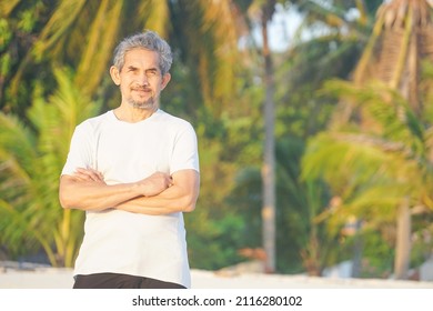 Portrait Senior Man Standing On The Sand Beach In The Summer, Concept Elderly People Lifestyle, Travel, Resting, Quality Of Life Etc