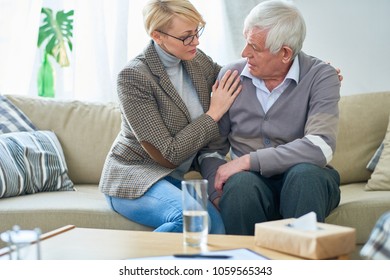 Portrait Of Senior Man Talking To Female Psychiatrist During Therapy Session, Copy Space