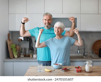 Portrait of a senior mature couple having a healthy breakfast after fitness exercise training in the morning at home - Powered by Shutterstock