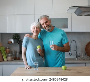 Portrait of a senior mature couple having a healthy breakfast after fitness exercise training in the morning at home - Powered by Shutterstock